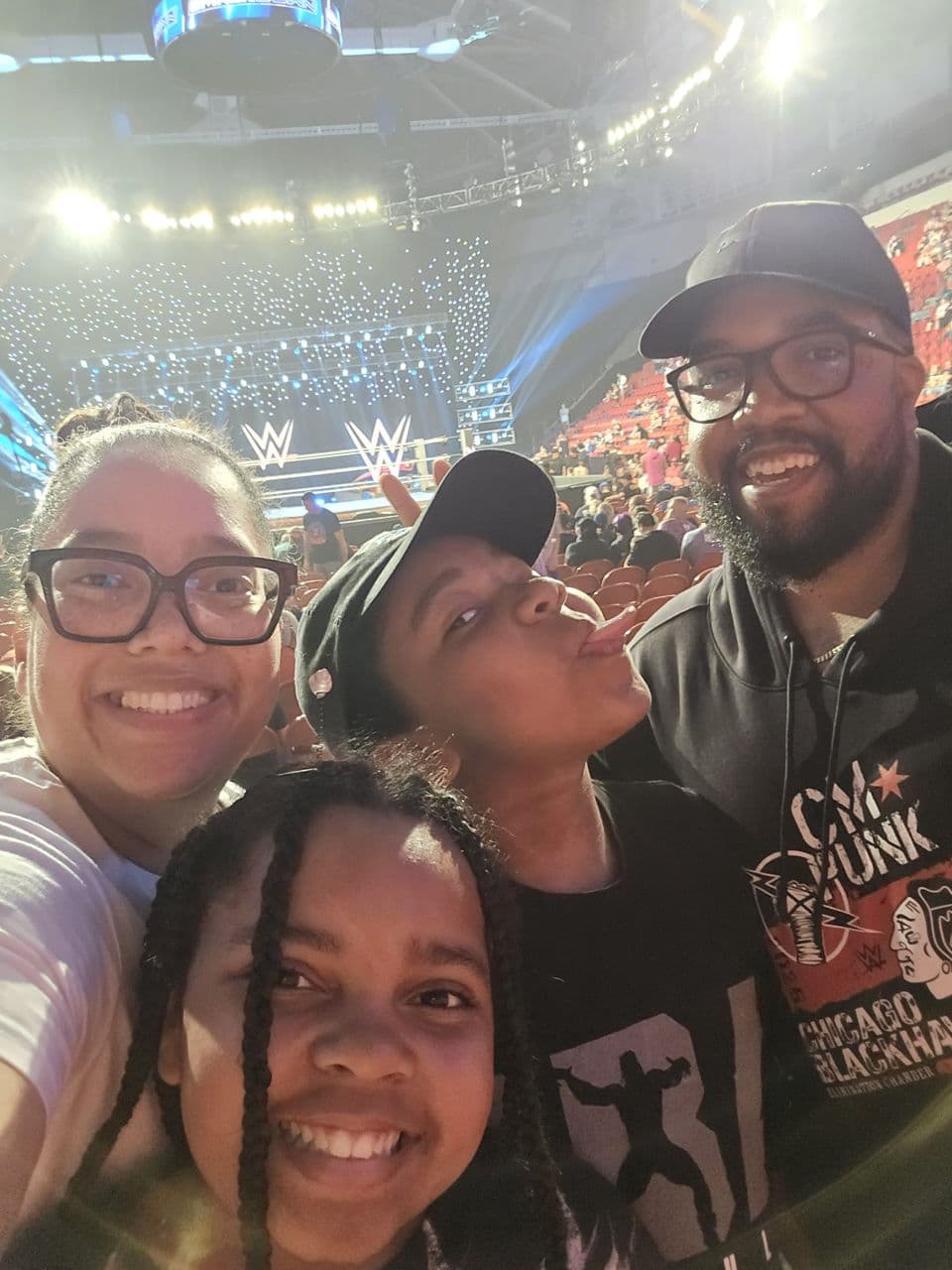 Joseph with his wife Deonda and their kids Caiden and Payton at a WWE event